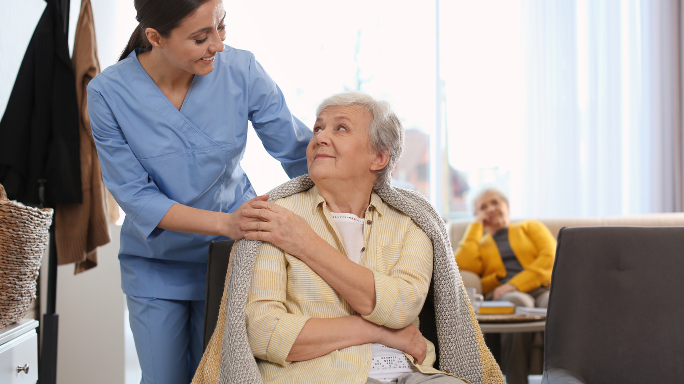 Senior care professional with elderly woman